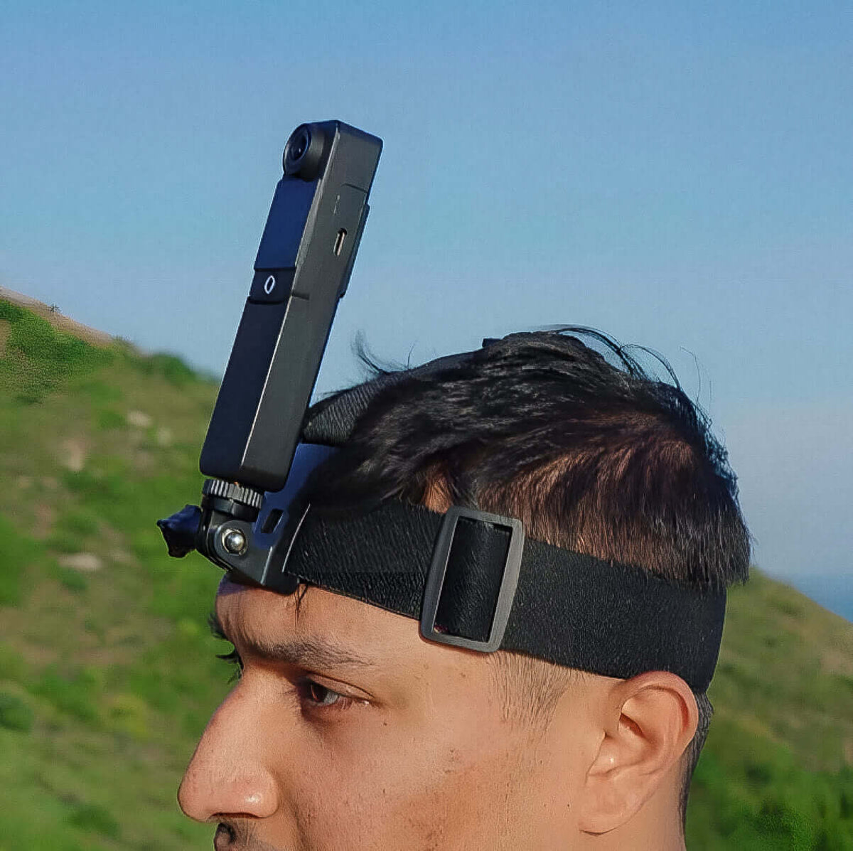 Head Strap worn by a man outdoors, featuring a camera attached for dynamic filming perspectives.